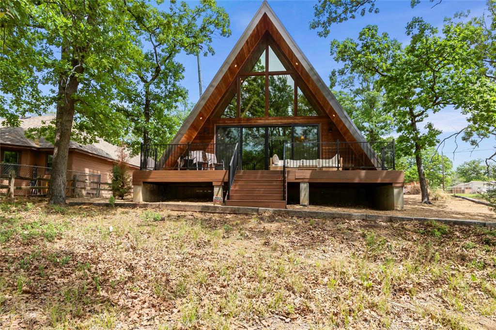 5706 Point La Vista Road Malakoff, TX 75148 - Photo 22 of 28 a house with trees in front of it