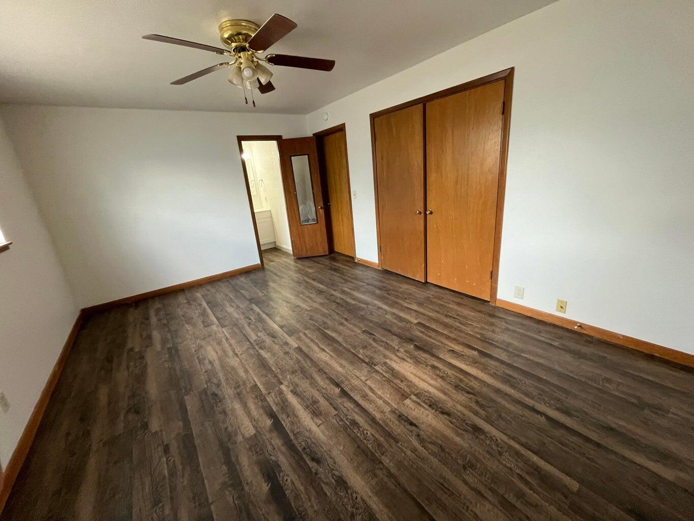 1307 Garland Plainview, TX 79072 - Photo 12 of 23 a view of empty room with wooden floor and fan