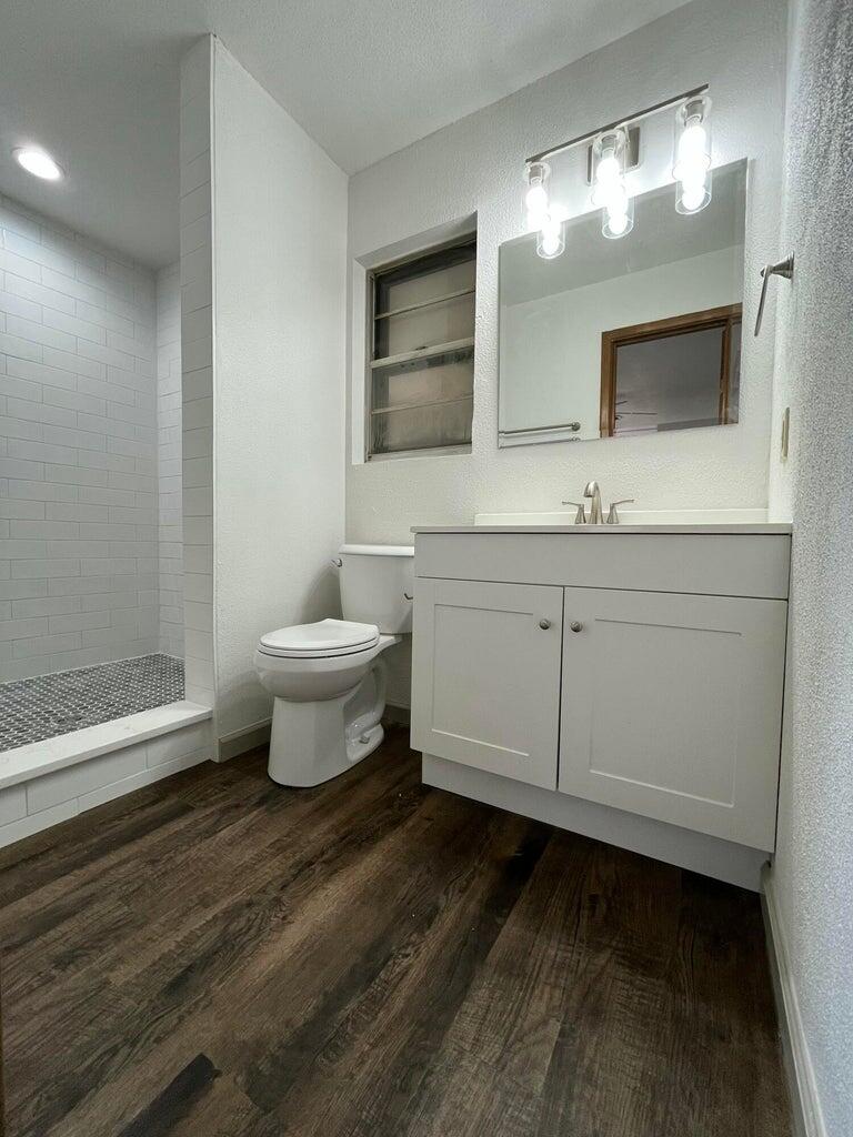 1307 Garland Plainview, TX 79072 - Photo 13 of 23 a bathroom with a sink and a mirror