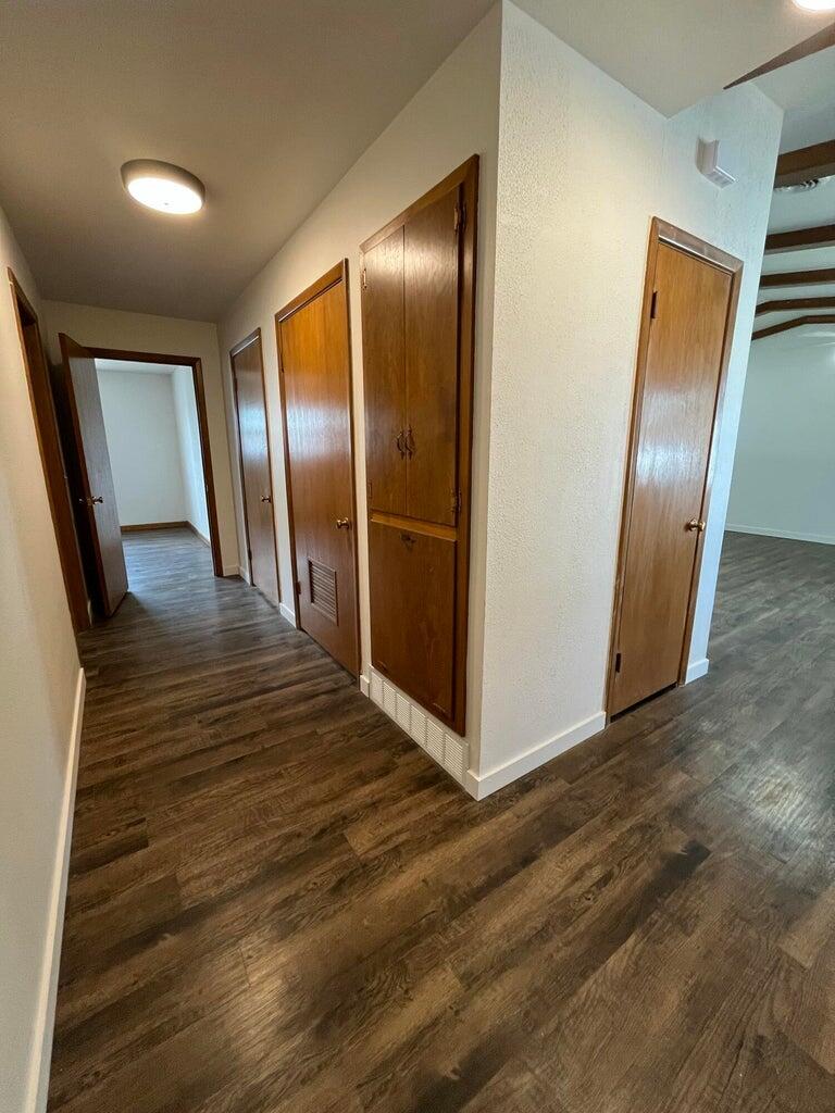 1307 Garland Plainview, TX 79072 - Photo 16 of 23 a view of a hallway with wooden floor