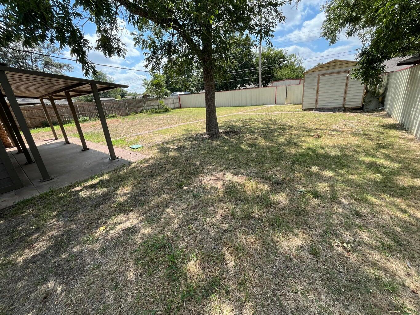 1307 Garland Plainview, TX 79072 - Photo 17 of 23 a house with trees in front of it