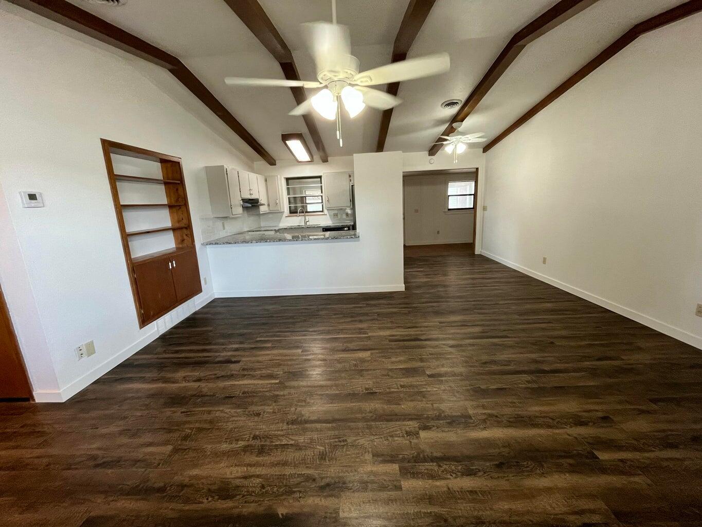 1307 Garland Plainview, TX 79072 - Photo 4 of 23 a view of empty room with wooden floor