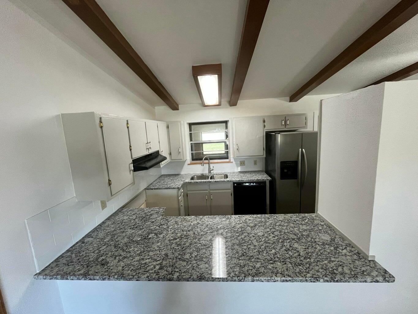 1307 Garland Plainview, TX 79072 - Photo 5 of 23 a kitchen with a refrigerator sink and stove