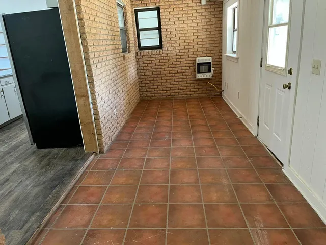 a view of a pathway door with wooden floor