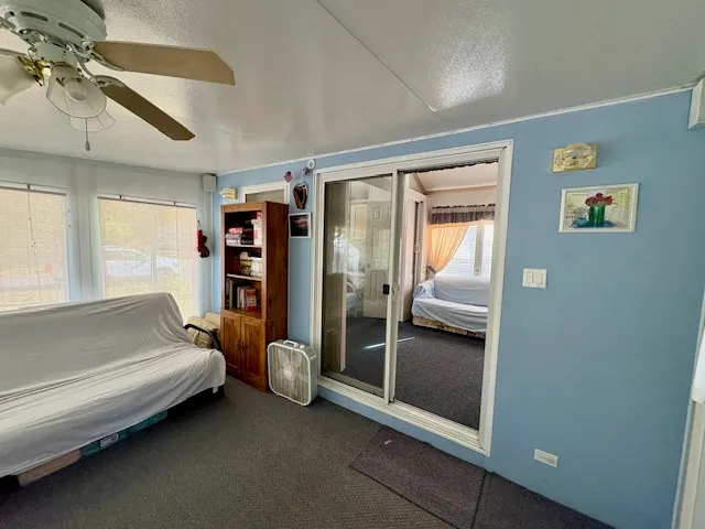 a bedroom with furniture and window