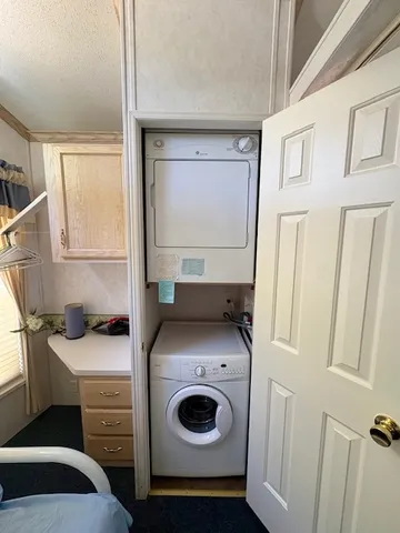 a utility room with sink dryer and washer