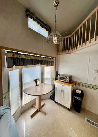 a bedroom with a bed and a mirror