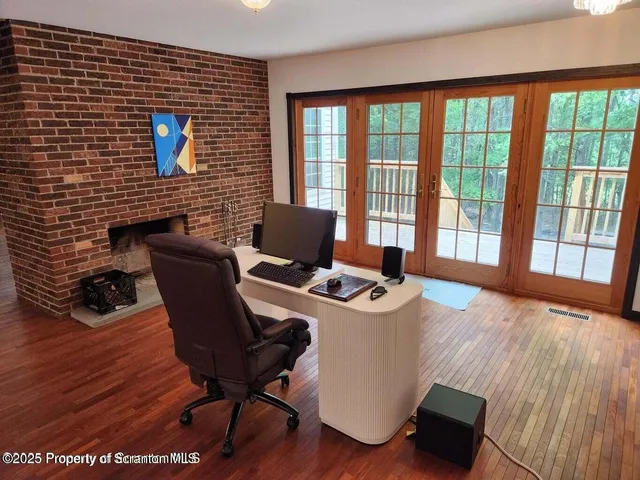 a view of balcony with wooden floor