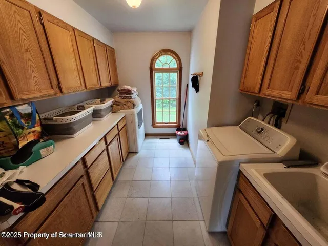 a bathroom with a window a toilet and a sink