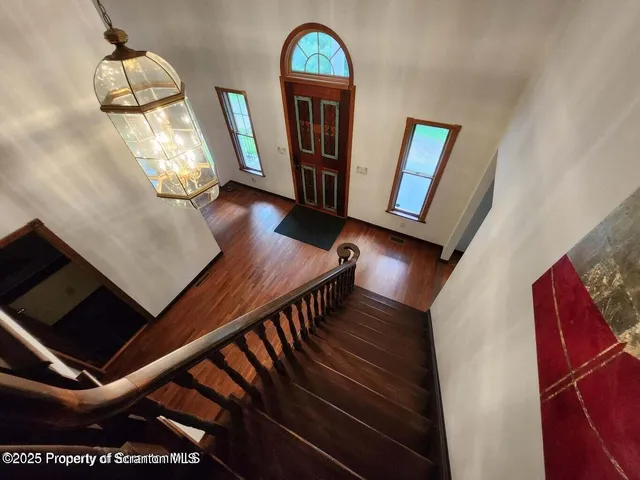 a view of entryway with wooden floor