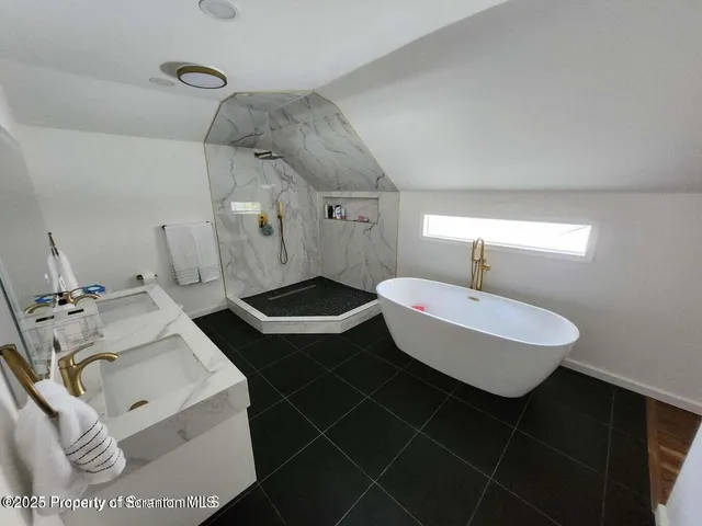 a bathroom with a shower and toilet