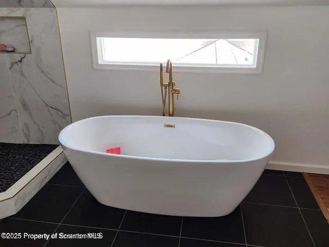 a bathroom with a sink toilet and mirror