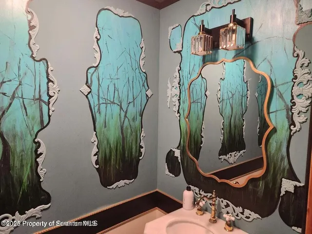 a living room with a bed furniture and a large window