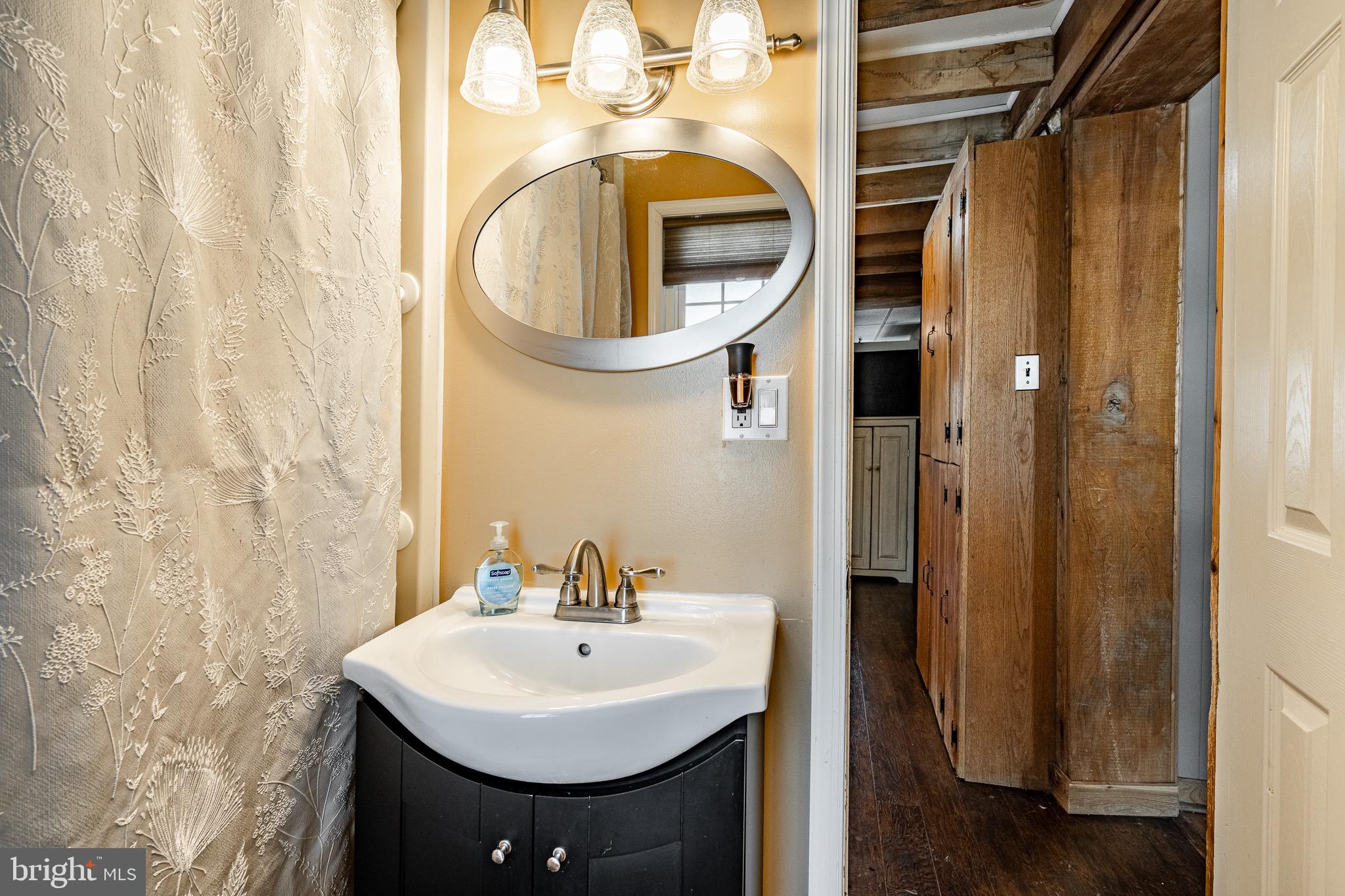 121 West Boot Road West Chester, PA 19380 - Photo 14 of 38 a bathroom with a sink and a mirror