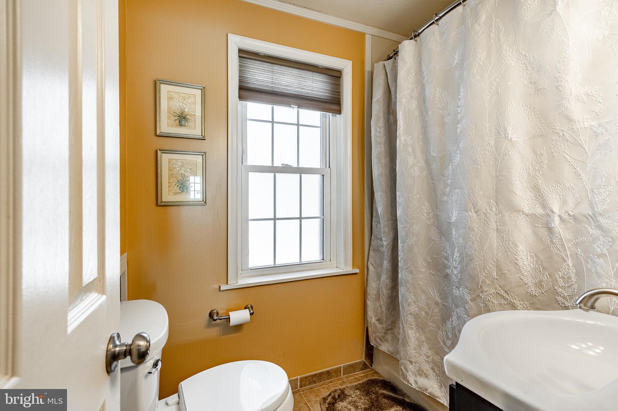 121 West Boot Road West Chester, PA 19380 - Photo 15 of 38 a bathroom with a sink a toilet and tub