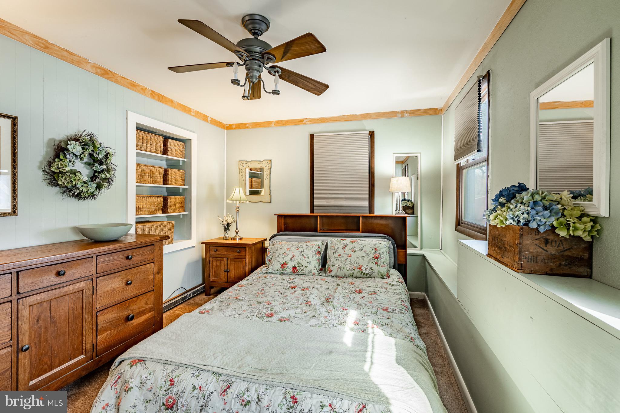 121 West Boot Road West Chester, PA 19380 - Photo 20 of 38 a large bedroom with a large bed and a chandelier