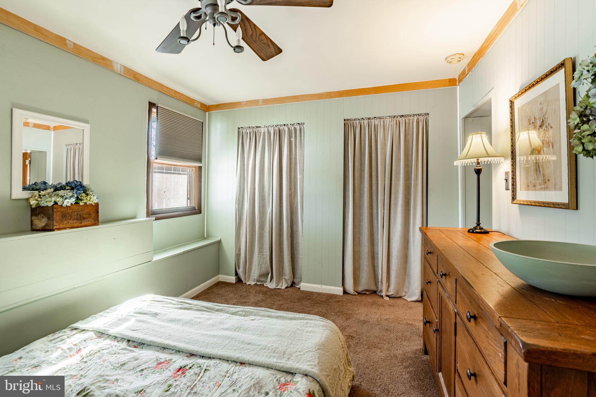 121 West Boot Road West Chester, PA 19380 - Photo 21 of 38 a bedroom with a bed and a chandelier