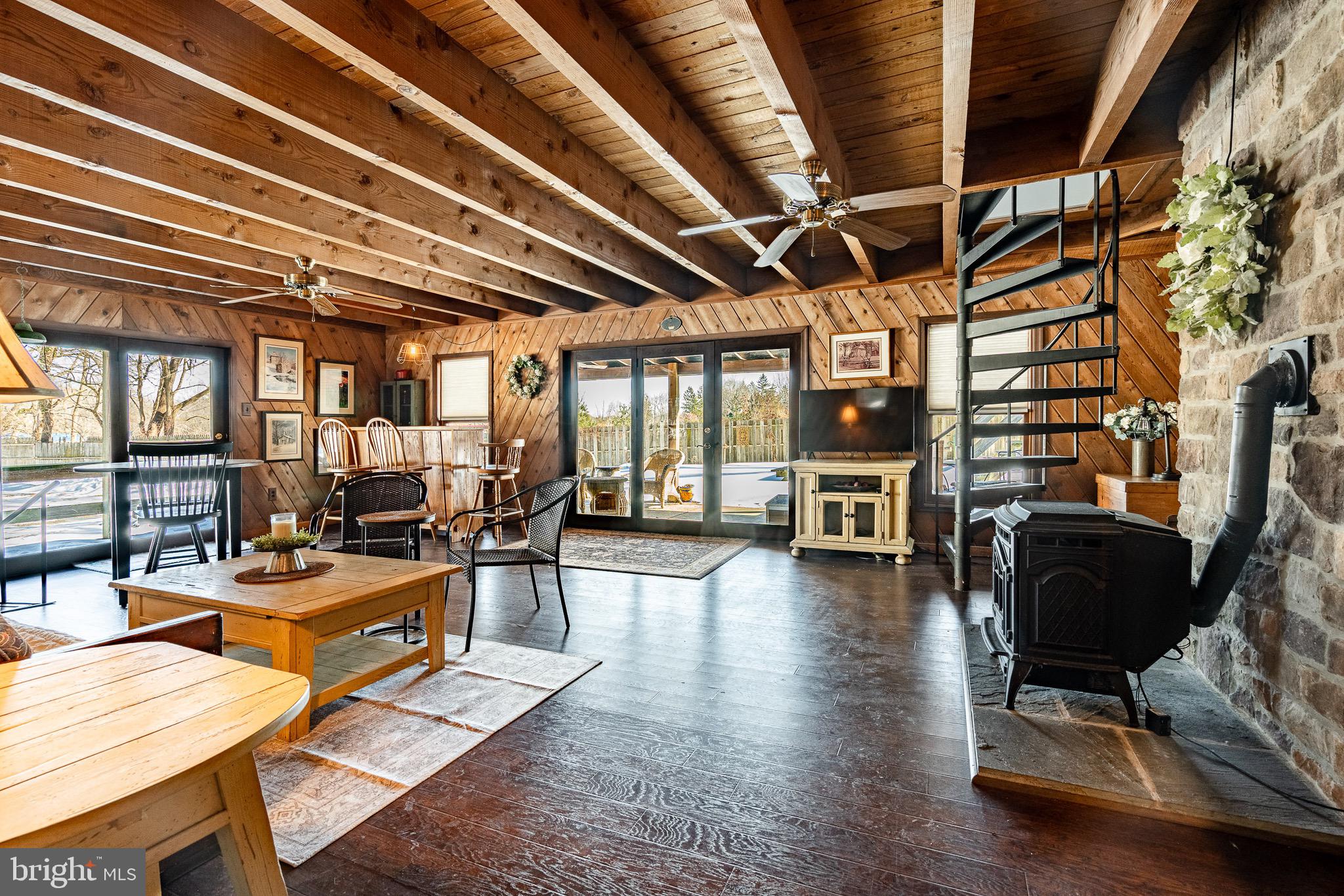 121 West Boot Road West Chester, PA 19380 - Photo 4 of 38 a view of a livingroom with furniture wooden floor and a floor to ceiling window