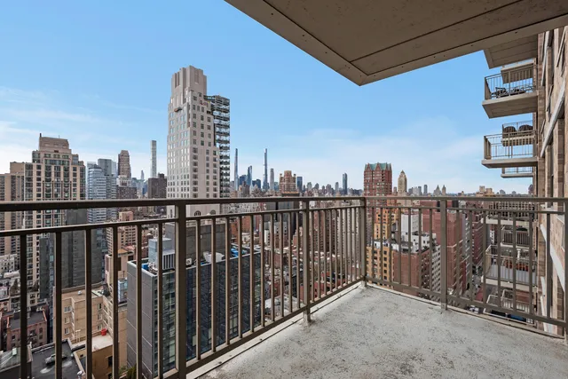 a picture of a bench in front of a wall