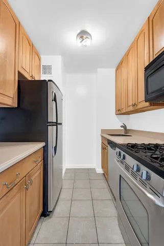 a view of an empty room and wooden floor