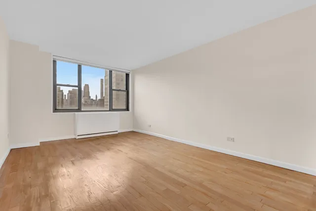 a kitchen with a stove a refrigerator and a sink