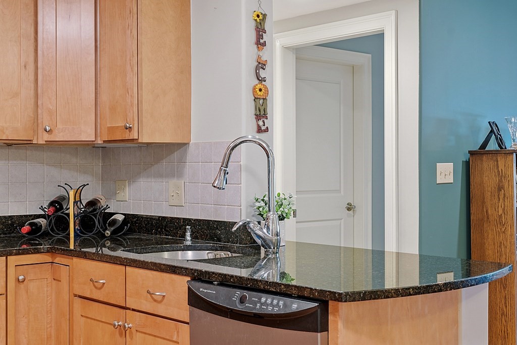 426 Main Street, Unit 205 Melrose, MA 02176 - Photo 15 of 26 a kitchen with a sink and cabinets
