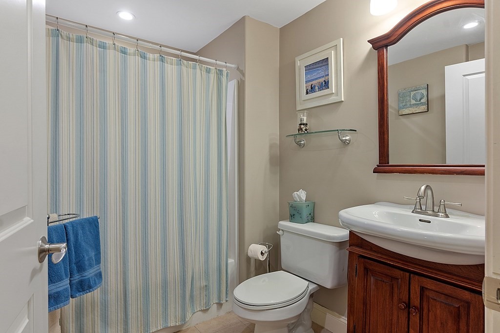 426 Main Street, Unit 205 Melrose, MA 02176 - Photo 16 of 26 a bathroom with a sink a toilet and shower