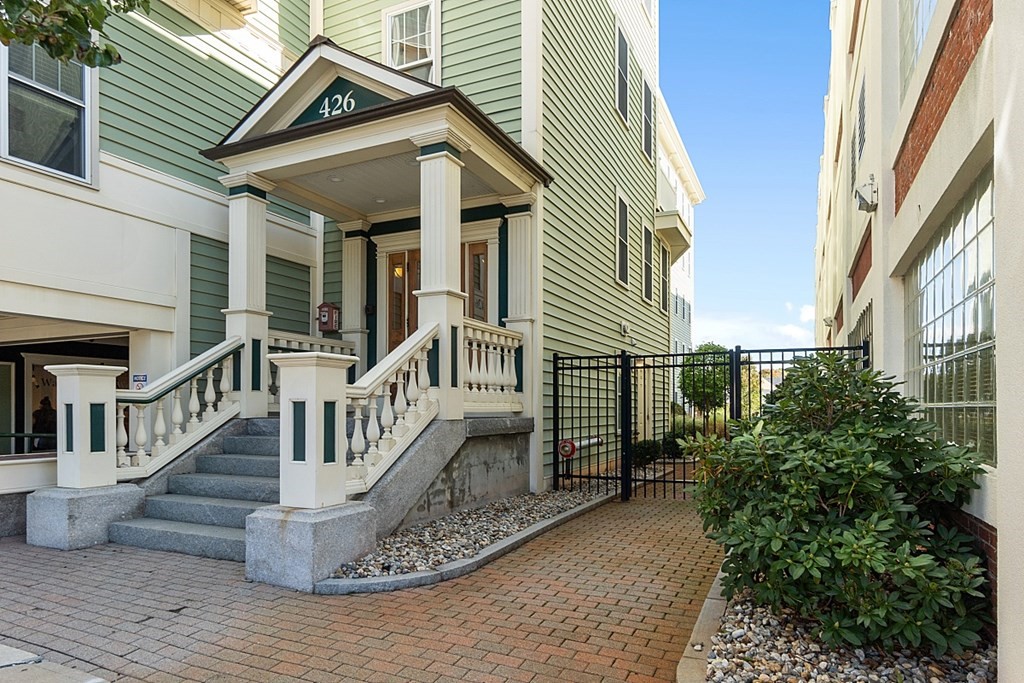 426 Main Street, Unit 205 Melrose, MA 02176 - Photo 2 of 26 a view of a house with wooden stairs