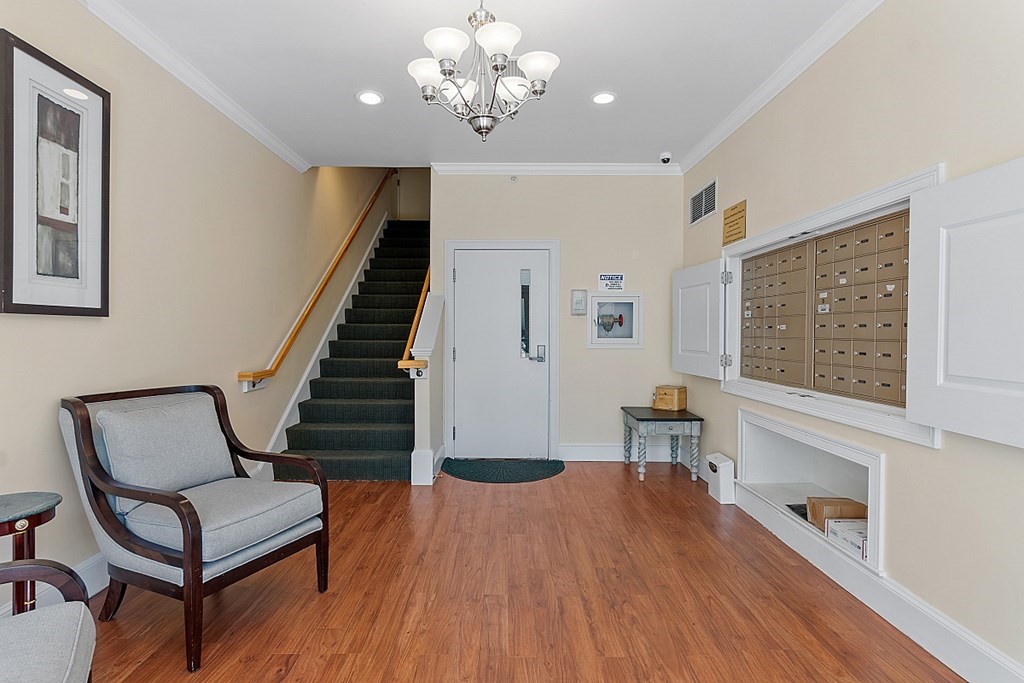 426 Main Street, Unit 205 Melrose, MA 02176 - Photo 25 of 26 a view of a livingroom with furniture and wooden floor