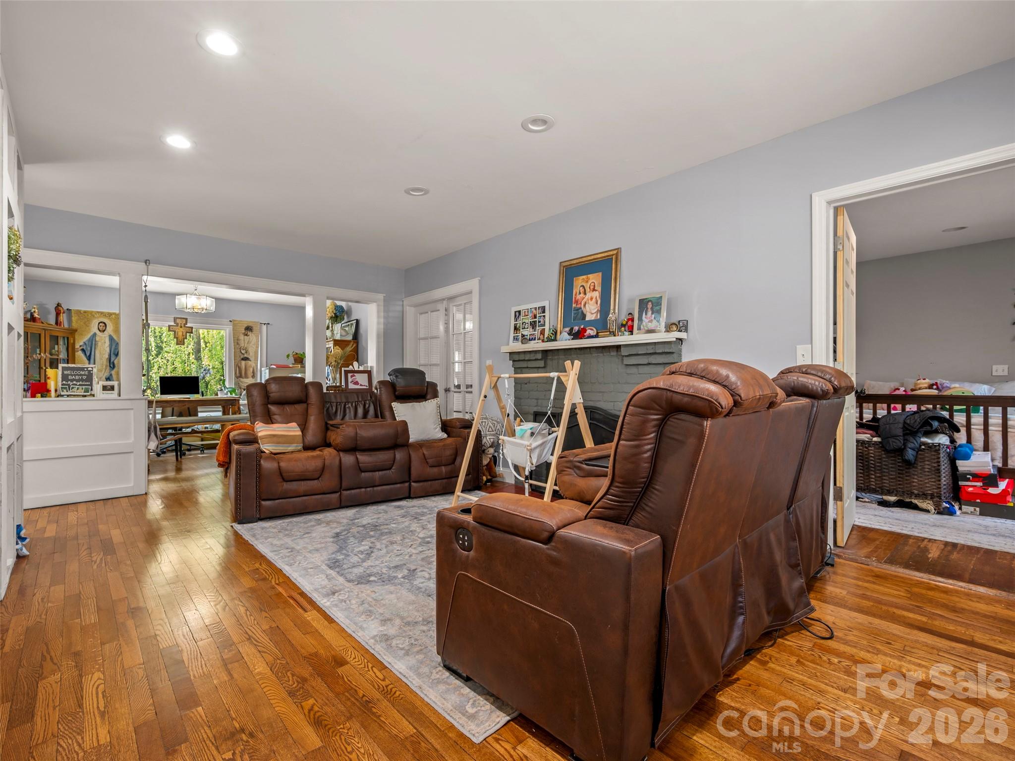 120 East Howard Street Tryon, NC 28782 - Photo 11 of 31 a living room with furniture and a wooden floor