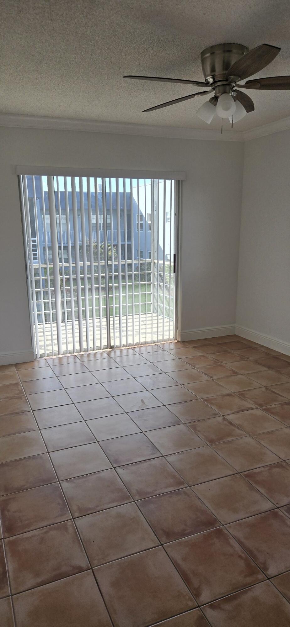 186 Burgandy Way Delray Beach, FL 33484 - Photo 14 of 26 a view of empty room with windows