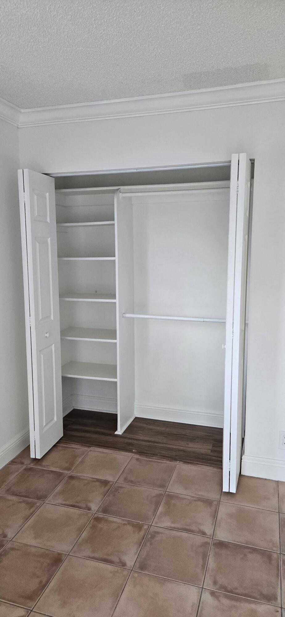 186 Burgandy Way Delray Beach, FL 33484 - Photo 16 of 26 a view of an empty walk in closet