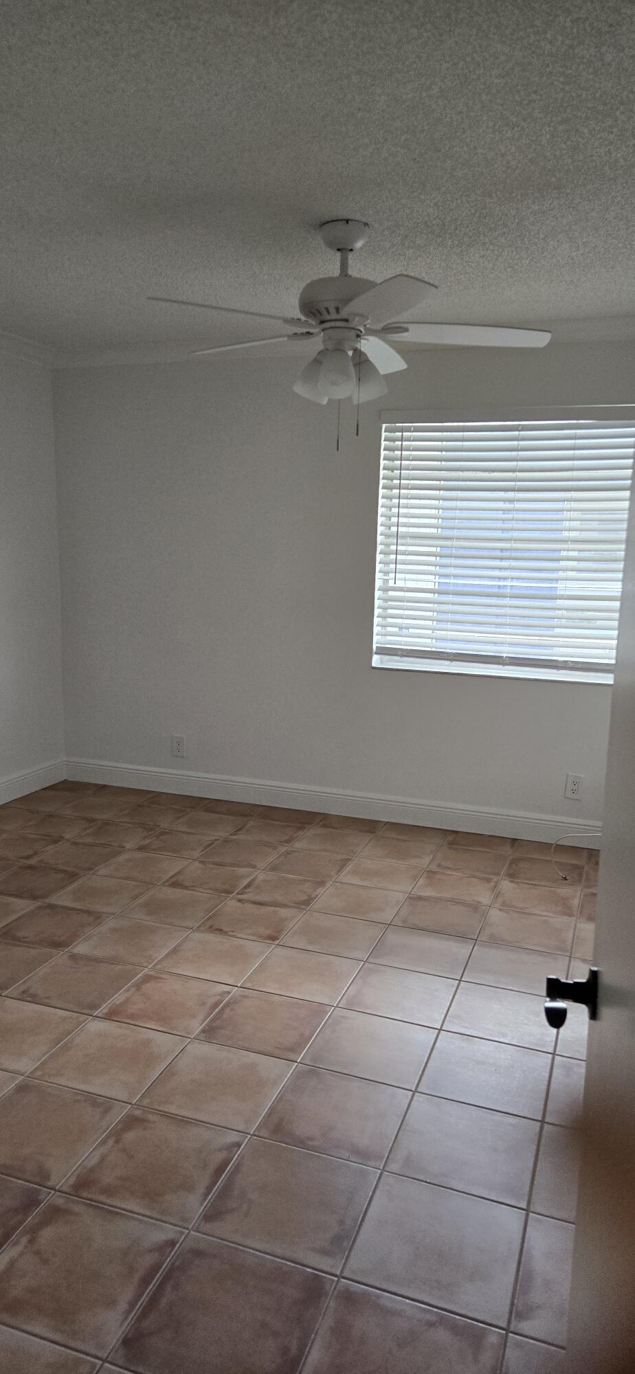 186 Burgandy Way Delray Beach, FL 33484 - Photo 24 of 26 a view of an empty room with a window