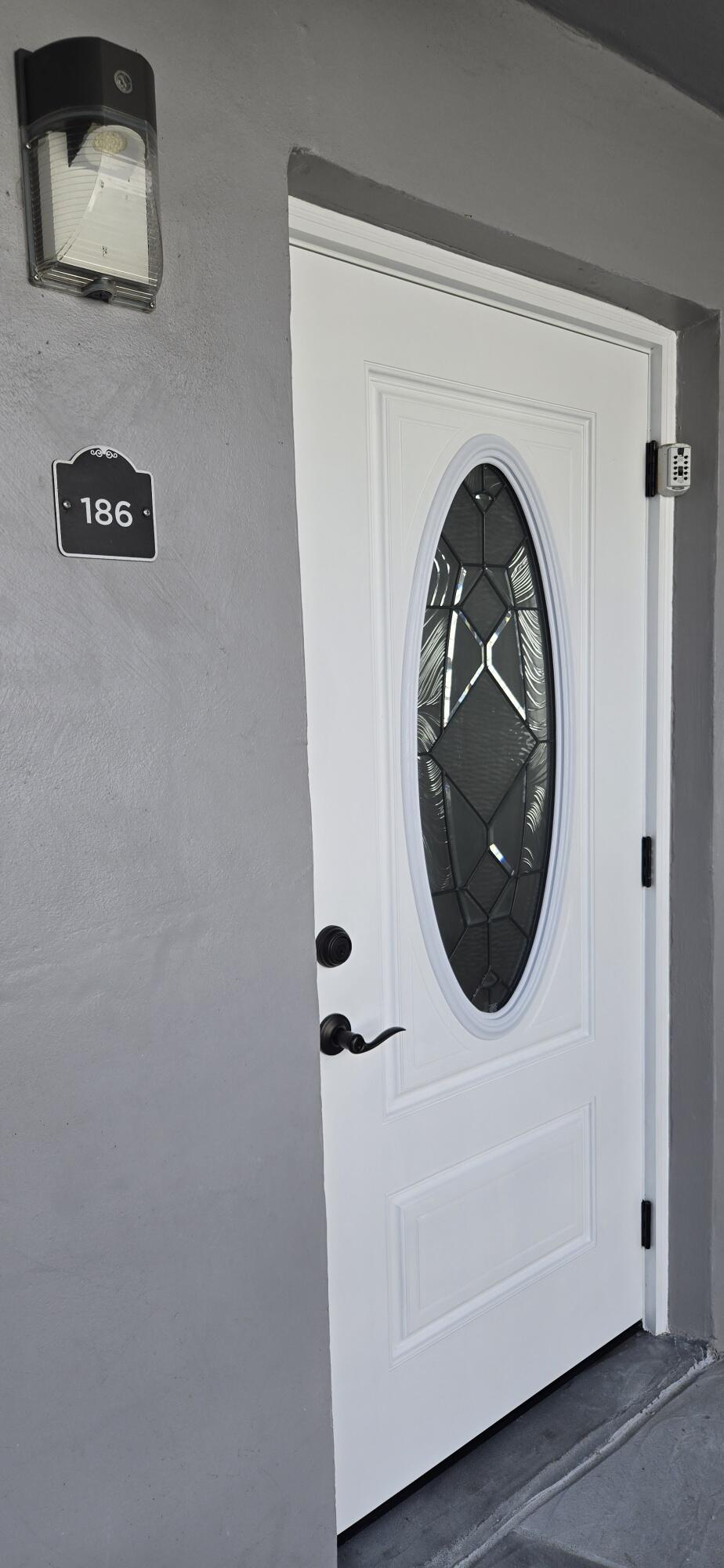 186 Burgandy Way Delray Beach, FL 33484 - Photo 3 of 26 a close up view of a washer and dryer