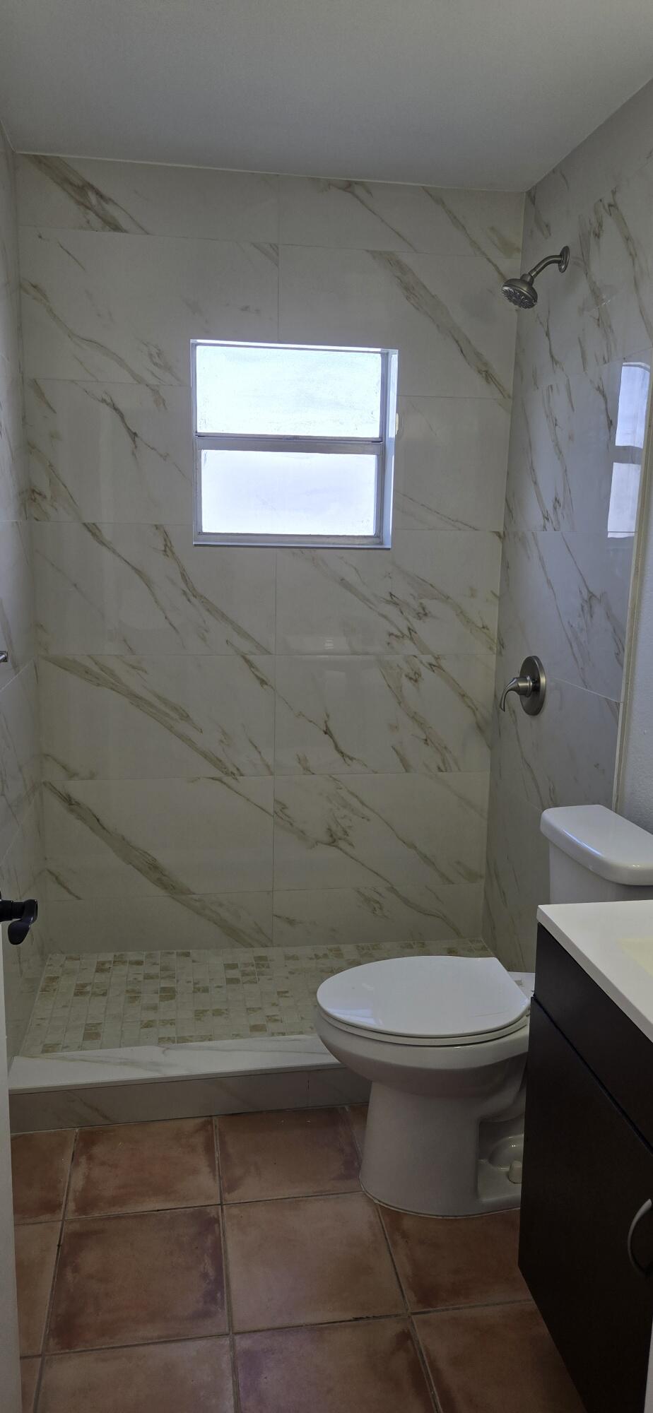 186 Burgandy Way Delray Beach, FL 33484 - Photo 10 of 26 a bathroom with a toilet and a shower