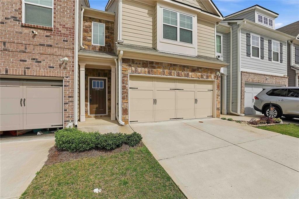7641 Squire Court Fairburn, GA 30213 - Photo 2 of 33 a view of a car garage