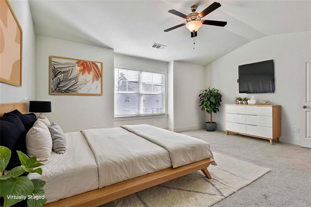 7641 Squire Court Fairburn, GA 30213 - Photo 22 of 33 a bedroom with a bed and ceiling fan