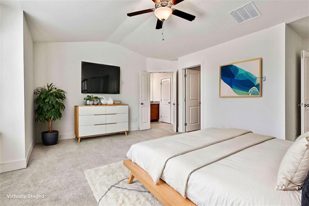 7641 Squire Court Fairburn, GA 30213 - Photo 23 of 33 a bedroom with a bed and a flat screen tv