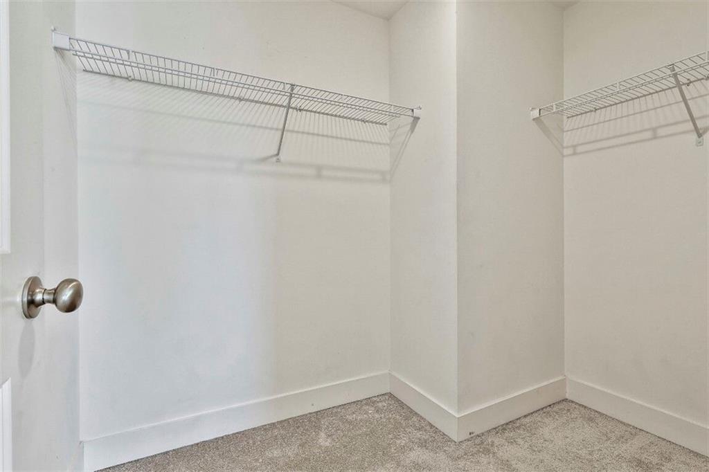 7641 Squire Court Fairburn, GA 30213 - Photo 26 of 33 a view of a room with racks on the wall