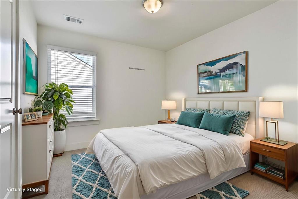 7641 Squire Court Fairburn, GA 30213 - Photo 29 of 33 a bedroom with a bed and a potted plant
