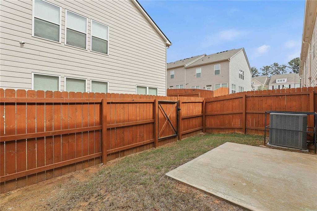 7641 Squire Court Fairburn, GA 30213 - Photo 31 of 33 a view of a house with wooden fence