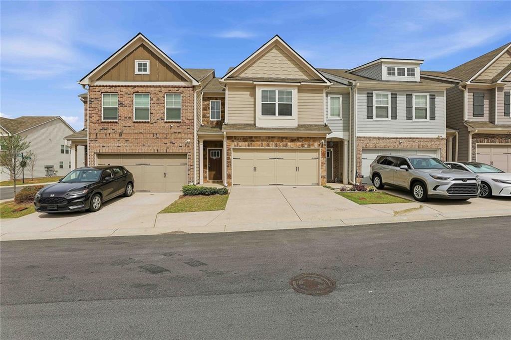 7641 Squire Court Fairburn, GA 30213 - Photo 33 of 33 a view of multiple houses with a yard