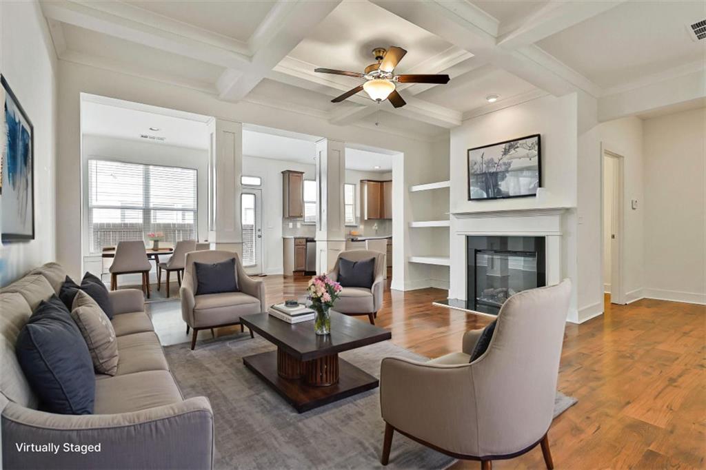 7641 Squire Court Fairburn, GA 30213 - Photo 6 of 33 a living room with furniture a fireplace and a large window