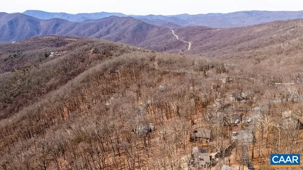 a view of mountains and valleys