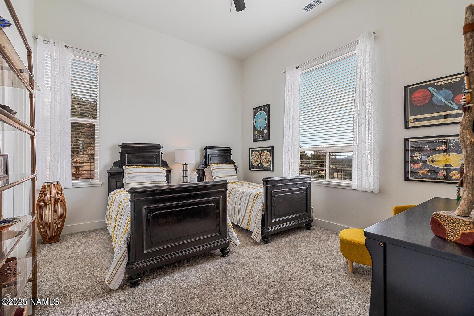 1843 East Sagebrush Road Williams, AZ 86046 - Photo 11 of 31 a bedroom with furniture and a window