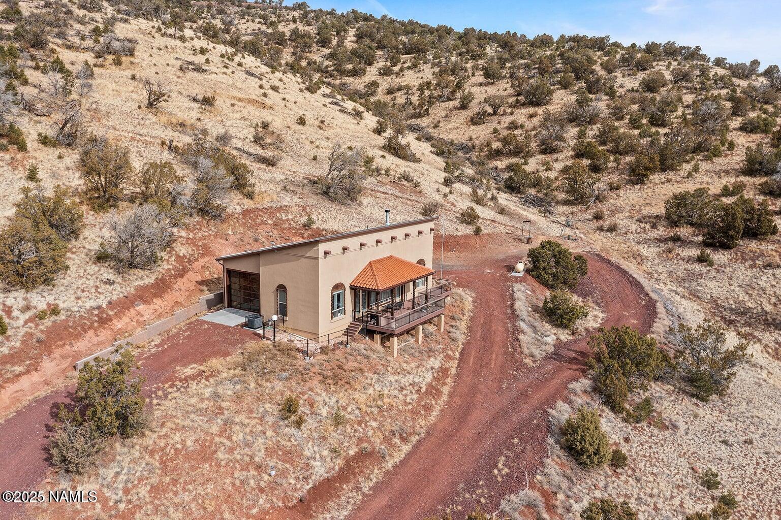 1843 East Sagebrush Road Williams, AZ 86046 - Photo 2 of 31 an aerial view of house with yard and mountain view in back