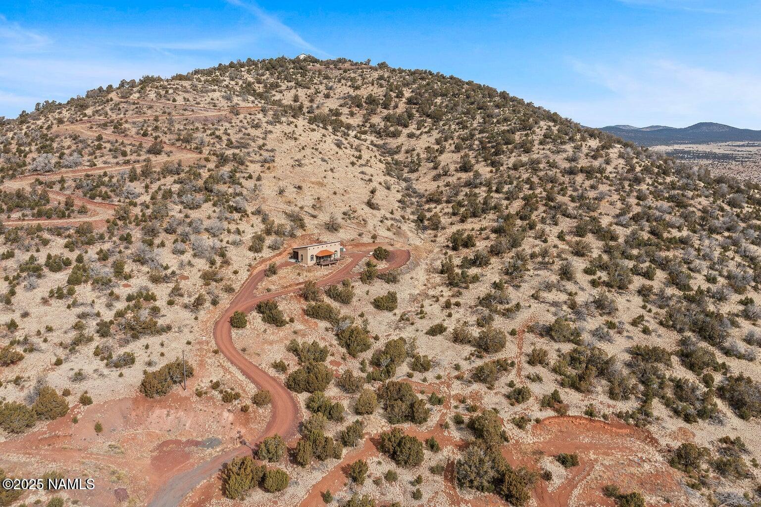 1843 East Sagebrush Road Williams, AZ 86046 - Photo 26 of 31 a view of a large mountain with a mountain in the background