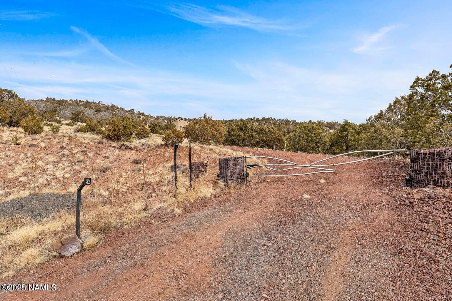 1843 East Sagebrush Road Williams, AZ 86046 - Photo 29 of 31 a view of a road with a yard