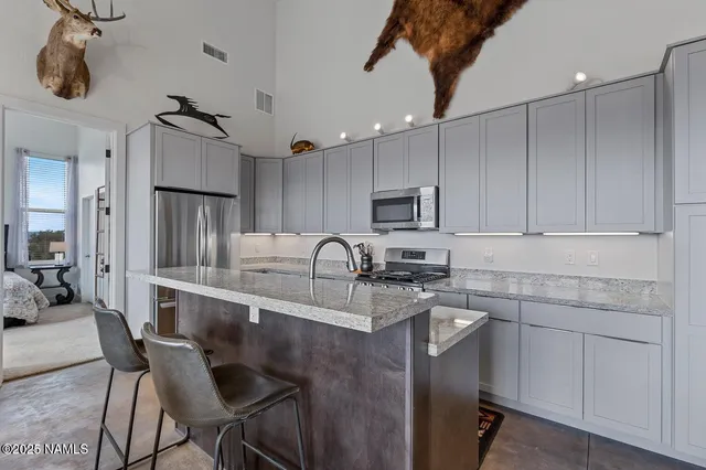 a kitchen with a sink cabinets and window