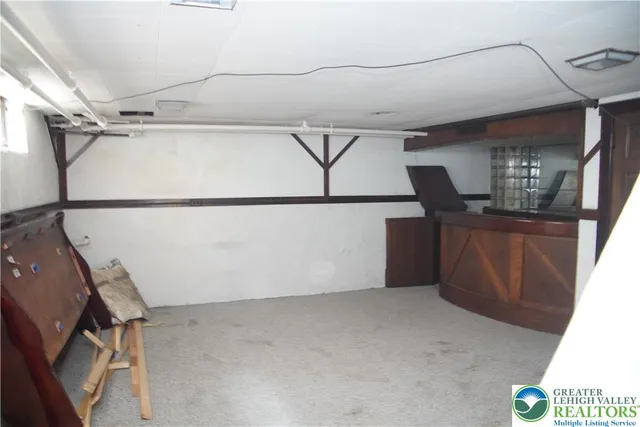 a bathroom with a sink a toilet a mirror and shower